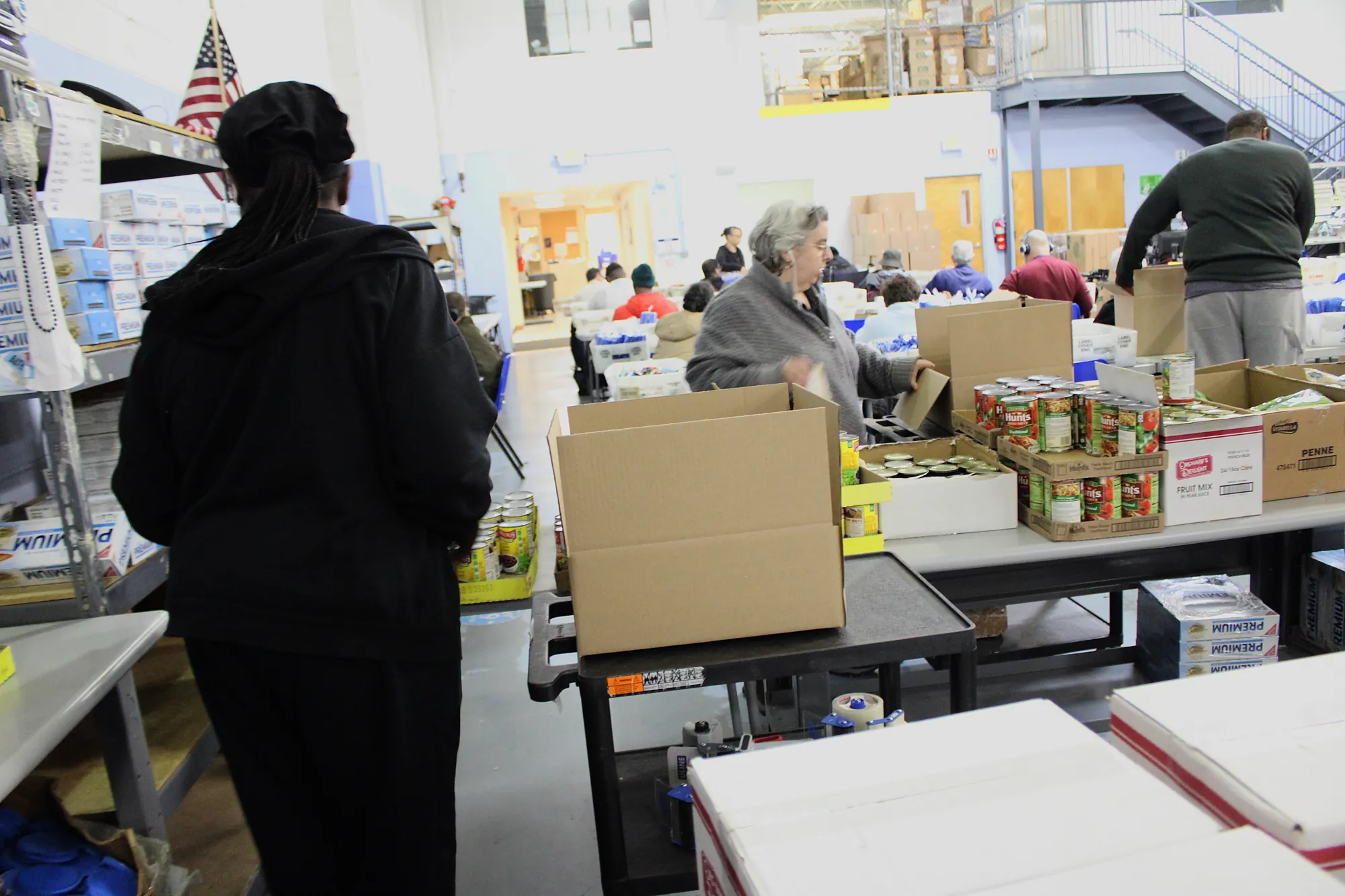 NJFH team members completing product assembly and packaging work