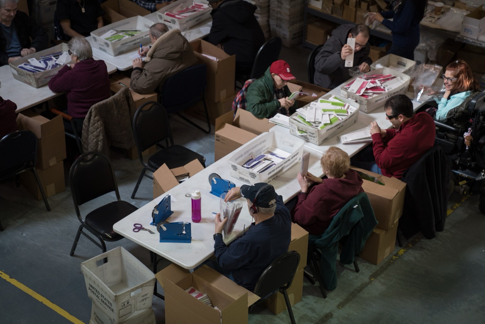 NJFH team members completing product assembly and packaging work